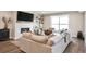 Inviting living room with a cozy fireplace, entertainment center, and comfortable seating arrangement at 3261 S Sherman St, Englewood, CO 80113
