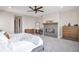 Spacious main bedroom featuring a fireplace, ceiling fan and wooden dresser at 3261 S Sherman St, Englewood, CO 80113