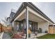 Inviting outdoor patio with dining area, grill, and landscaped surroundings, perfect for entertaining at 3261 S Sherman St, Englewood, CO 80113