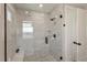 Modern glass shower with tiled walls, built-in bench and shower-head at 3261 S Sherman St, Englewood, CO 80113