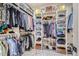 Organized walk-in closet with ample shelving, hanging space, and stylish storage solutions at 3261 S Sherman St, Englewood, CO 80113