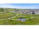 A beautiful aerial view of the community park, homes, and green spaces in a well-planned neighborhood at 6185 Saddle Bow Ave, Parker, CO 80134