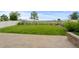 A large, grassy yard with a patio, surrounded by a white picket fence at 6185 Saddle Bow Ave, Parker, CO 80134
