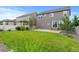 Spacious backyard featuring a well-maintained lawn and a cozy patio area at 6185 Saddle Bow Ave, Parker, CO 80134