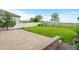 A large, grassy yard with a patio, surrounded by a white picket fence at 6185 Saddle Bow Ave, Parker, CO 80134