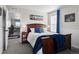 Comfortable bedroom featuring a well-made bed, side tables, and natural light from the windows at 6185 Saddle Bow Ave, Parker, CO 80134