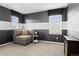 Relaxing bedroom showcasing a cozy chair, a side table, and windows for natural light at 6185 Saddle Bow Ave, Parker, CO 80134