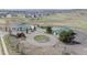 Aerial view of a community featuring amenities, green spaces, and circular driveways at 6185 Saddle Bow Ave, Parker, CO 80134