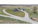 Aerial view of a community park with playground, gazebo, walking path, and open green space at 6185 Saddle Bow Ave, Parker, CO 80134