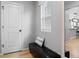 Cozy entryway with a cushioned bench and a decorative mirror, offering a welcoming first impression at 6185 Saddle Bow Ave, Parker, CO 80134