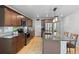 Modern kitchen featuring granite countertops, stainless steel appliances, and a large island at 6185 Saddle Bow Ave, Parker, CO 80134
