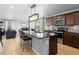 Contemporary kitchen with a kitchen island, stainless steel appliances, and an open concept layout at 6185 Saddle Bow Ave, Parker, CO 80134