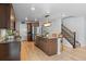 Beautiful kitchen with stainless steel appliances, a kitchen island, and a seamless flow into other living areas at 6185 Saddle Bow Ave, Parker, CO 80134