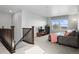 Bright and airy living room with a comfortable sofa, large window, and stylish decor at 6185 Saddle Bow Ave, Parker, CO 80134