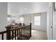 Upstairs living area featuring a cozy sofa, natural light, and stylish staircase with wood railing at 6185 Saddle Bow Ave, Parker, CO 80134