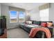Cozy living room with a large sectional sofa, comfortable cushions, and large windows at 6185 Saddle Bow Ave, Parker, CO 80134