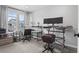 A well-lit office space with modern desk setups and a cozy seating area, perfect for a productive workday at 6185 Saddle Bow Ave, Parker, CO 80134