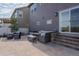 Outdoor patio featuring comfortable seating, a dining area, and elegant brickwork for outdoor enjoyment at 6185 Saddle Bow Ave, Parker, CO 80134