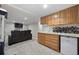 Finished basement featuring a wet bar, wine rack, and entertainment area with a large sectional couch at 4235 Lark Sparrow St, Highlands Ranch, CO 80126