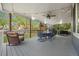 Spacious covered patio with a dining set, ceiling fan, and string lights, perfect for outdoor entertaining at 4235 Lark Sparrow St, Highlands Ranch, CO 80126
