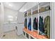 Well-organized mud room featuring built-in lockers, bench seating, and laundry area with modern appliances at 4235 Lark Sparrow St, Highlands Ranch, CO 80126