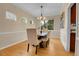 Elegant dining room with a wooden table, comfortable seating, and stylish chandelier at 4961 Aspen Creek Dr, Broomfield, CO 80023