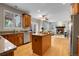 Open kitchen with granite countertops, stainless steel appliances, and hardwood floors at 4961 Aspen Creek Dr, Broomfield, CO 80023