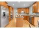 Spacious kitchen with granite countertops, stainless steel appliances, and a central island at 4961 Aspen Creek Dr, Broomfield, CO 80023