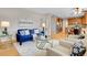 Bright living room open to the kitchen features stylish furniture and a modern open layout at 4961 Aspen Creek Dr, Broomfield, CO 80023
