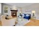Inviting living room featuring a cozy fireplace, stylish furniture, and modern decor at 4961 Aspen Creek Dr, Broomfield, CO 80023