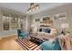 Bright living room with modern decor, stylish furnishings, and natural light at 4961 Aspen Creek Dr, Broomfield, CO 80023