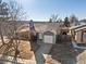 Aerial view of the home, detached garage, driveway, and backyard at 17990 E Cornell Dr, Aurora, CO 80013