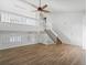 Inviting living room showcasing hardwood floors, an open layout, and a staircase to the upper level at 17990 E Cornell Dr, Aurora, CO 80013