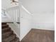 Open living room with neutral carpet, white banister, ready for customization at 17990 E Cornell Dr, Aurora, CO 80013