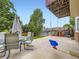 Outdoor patio with dining set, swing, and fenced-in play area, perfect for relaxing and entertaining at 4904 E 125Th Ave, Thornton, CO 80241