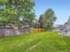 Beautiful backyard featuring lush green grass and a privacy fence, great for outdoor activities at 4904 E 125Th Ave, Thornton, CO 80241