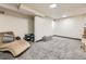Cozy basement featuring soft lighting, comfortable seating, and ample space at 4904 E 125Th Ave, Thornton, CO 80241