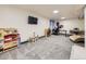 Bright basement with plush carpet, TV, and play area, perfect for Gathering fun at 4904 E 125Th Ave, Thornton, CO 80241