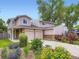 Charming home featuring a two-car garage, well-manicured landscaping, and a welcoming front entrance at 4904 E 125Th Ave, Thornton, CO 80241