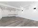 Finished basement featuring built-in seating, natural light, and modern recessed lighting at 5886 S Logan St, Centennial, CO 80121