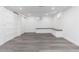 Finished basement space with built-in bench seating, closet space, and modern flooring at 5886 S Logan St, Centennial, CO 80121