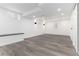 Finished basement featuring built-in bench, wood-look flooring, and recessed lighting at 5886 S Logan St, Centennial, CO 80121