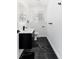 Modern bathroom features a black vanity, marble floors, and sleek fixtures at 5886 S Logan St, Centennial, CO 80121