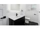 Modern bathroom with a black vanity, and a marble tile floor at 5886 S Logan St, Centennial, CO 80121