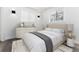 Comfortable bedroom with a light colored bed and gray accents at 5886 S Logan St, Centennial, CO 80121