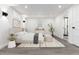 Cozy bedroom features modern decor, neutral colors, and an adjacent bathroom with a glass door at 5886 S Logan St, Centennial, CO 80121