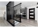 Stylish home interior featuring gray cabinets, stainless appliances and gray wood flooring at 5886 S Logan St, Centennial, CO 80121