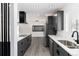 Bright kitchen featuring gray cabinets, stainless steel appliances, and white countertops, creating a contemporary and inviting space at 5886 S Logan St, Centennial, CO 80121