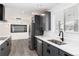 Modern kitchen featuring gray cabinets, stainless steel appliances, and white countertops, creating a bright and functional space at 5886 S Logan St, Centennial, CO 80121