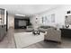 Cozy living room with fireplace, decorative shelving and sleek gray flooring at 5886 S Logan St, Centennial, CO 80121